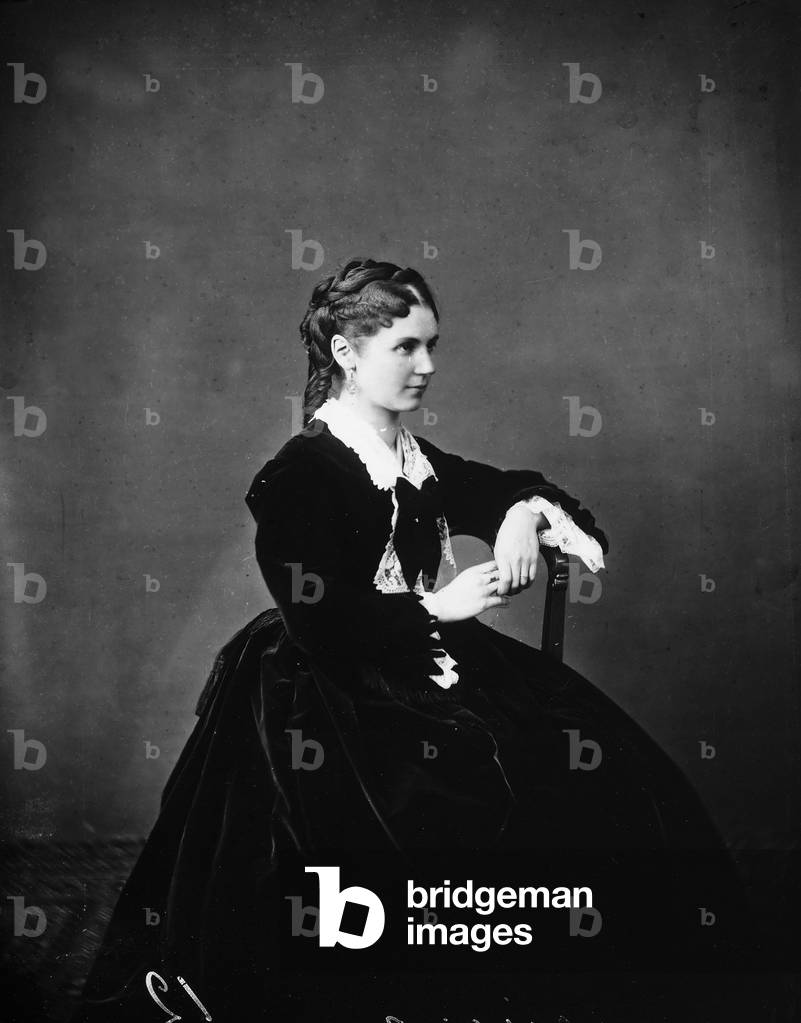 Portrait of young woman, sitting, in nineteenth century costume
