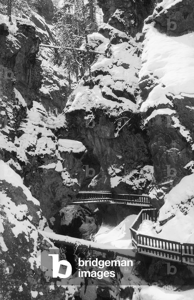 View of snow of a mountain gorge with pedestrian walkway near Zermatt