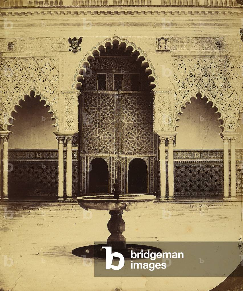 A hall with a fountain in the center, in the Palace of the Alhambra, in Granada
