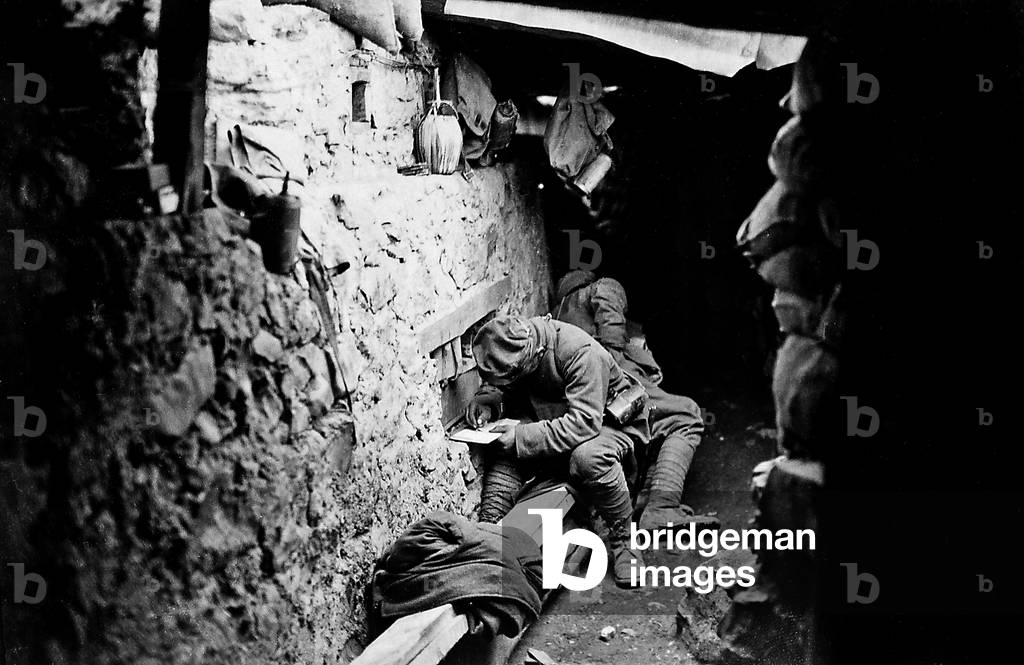 Soldiers write to their beloved during World War I (b/w photo)