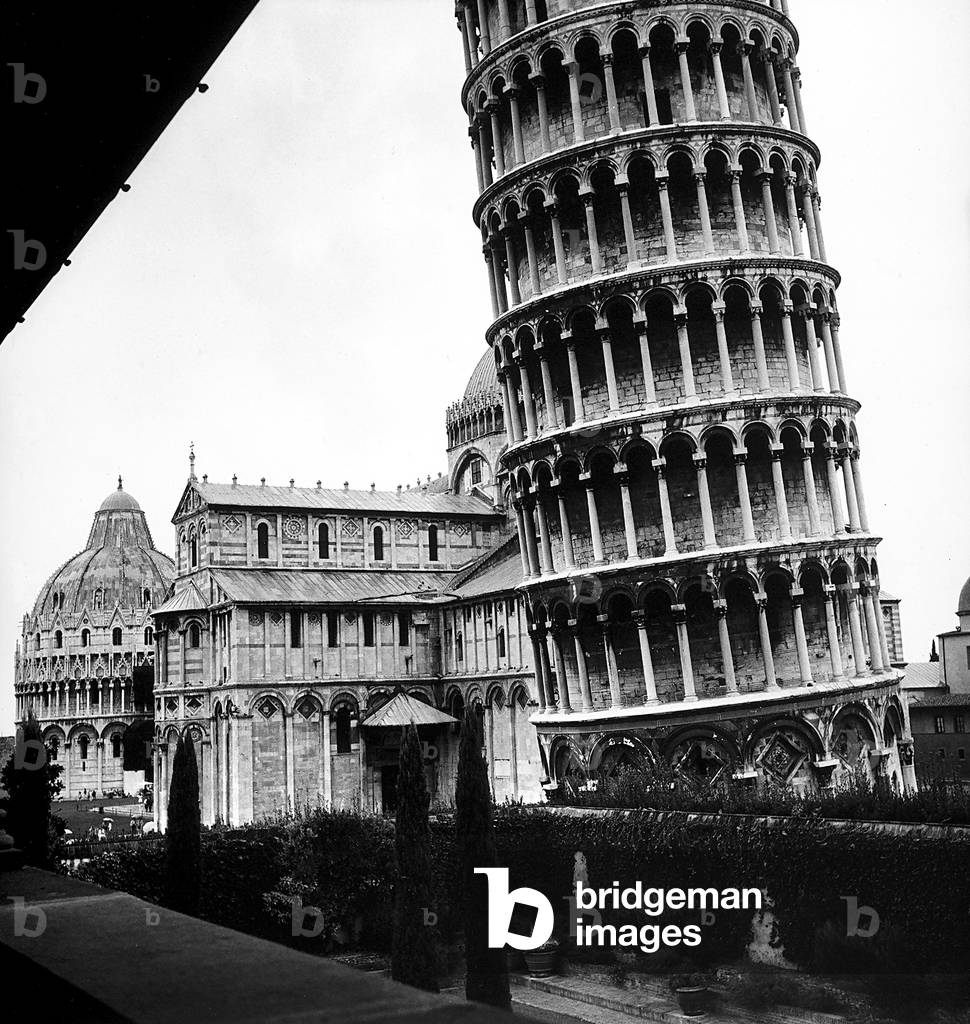 The tower, one arm of the transept of the Cathedral and the Baptistry of Pisa