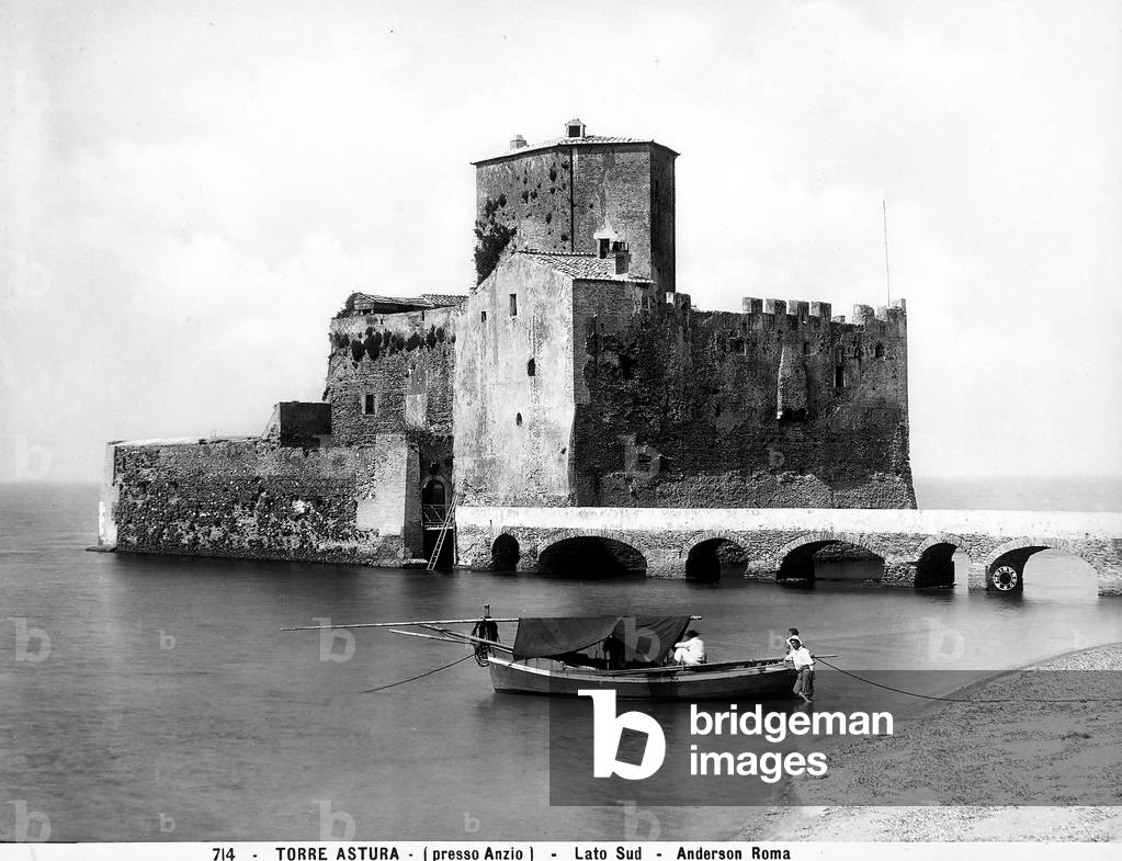 Fishermen on a boat, photographed on the sea in front of the Torre Astura castle in Nettuno, near Anzio, in the province of Rome