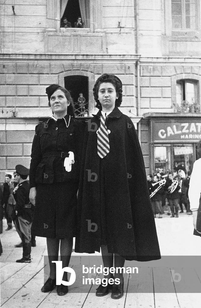 Full figure portrait of two young Fascist activists in Piazza della Prefettura in Campobasso.