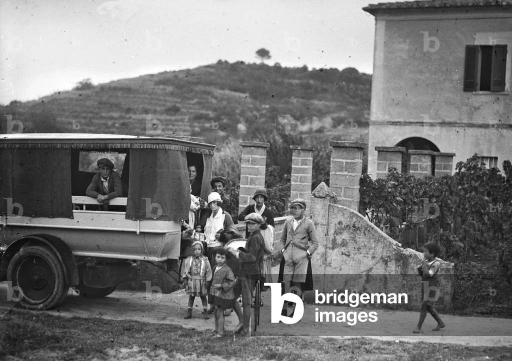 Group portrait beside a car in Procchio, Elba Island