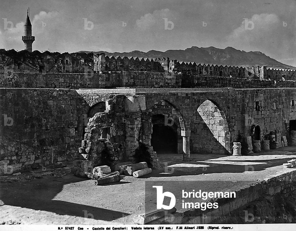 Interior of the Castle of the Island of Kos, arches and ancient fragments are in the foreground. Kos.