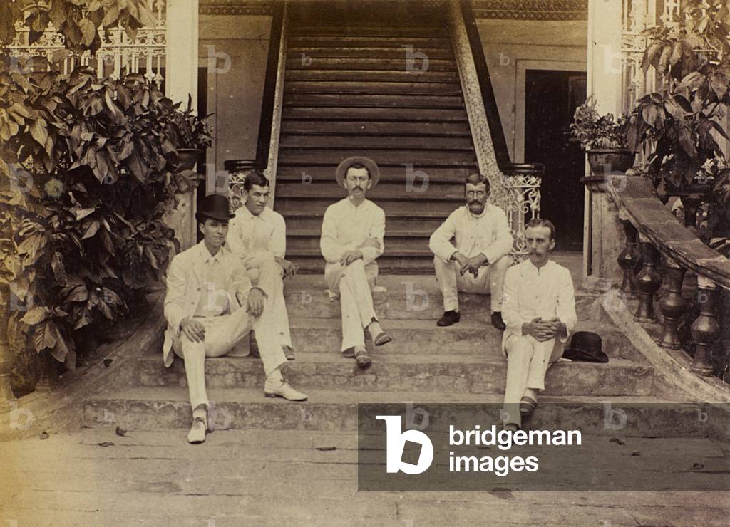 English group photographed in front of the entrance to his villa in China