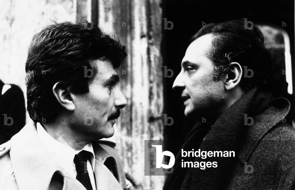 Close-up of the writers Alberto Arbasino and Enzo Siciliano outdoors.