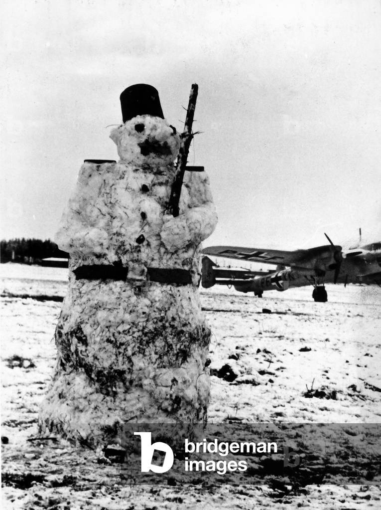 The snowman is put in place of a sentry in the point where the identification is requested. The image dates back to the World War II, to the war between Germany and Russia.