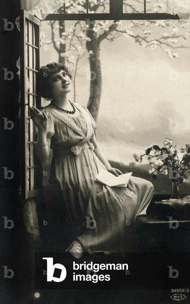 Portrait of a girl at the window