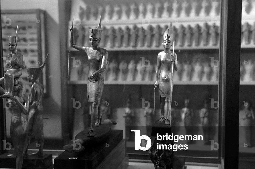 Gilded wooden statues of the boy-king Tutankhamon previously stored at the Egyptian Museum of Cairo, stolen today