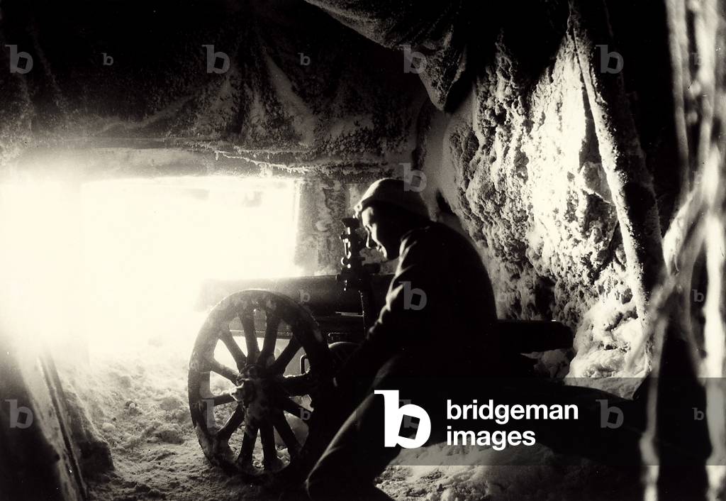 Italian soldier in a snow cave on Monte Nero during World War I (b/w photo)