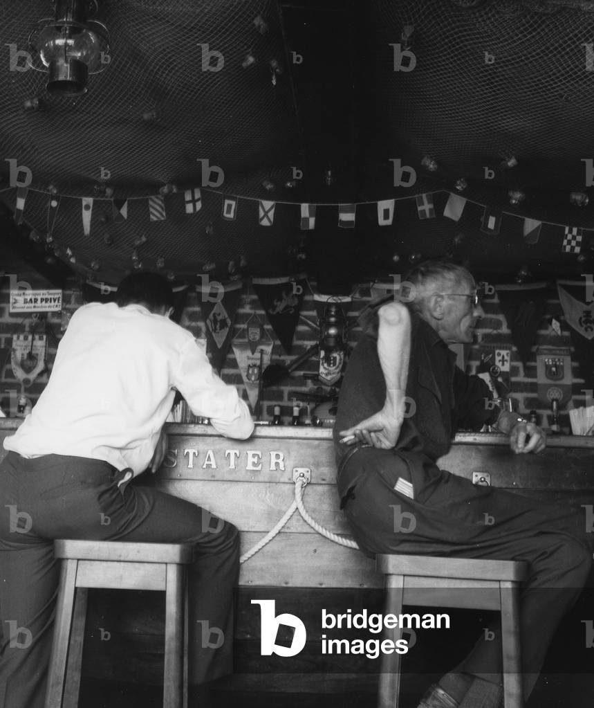 Customers at the bar of the 