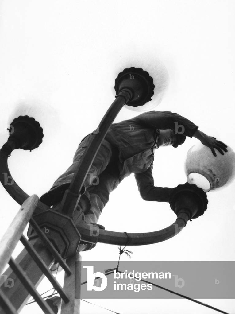 Young lamp-lighter, Italy, c.1960 (gelatin silver print)