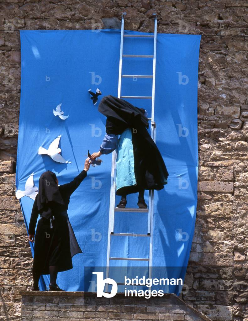 Preparing a poster for the March for Peace, Assisi, Italy, 1994 (digital photo)
