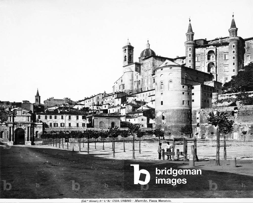 Panoramic view of the town of Urbino from Piazza Mercatale. In the background is the gate of Valbona and on the right is the façade of Torricini (small towers) by Luciano Laurana.