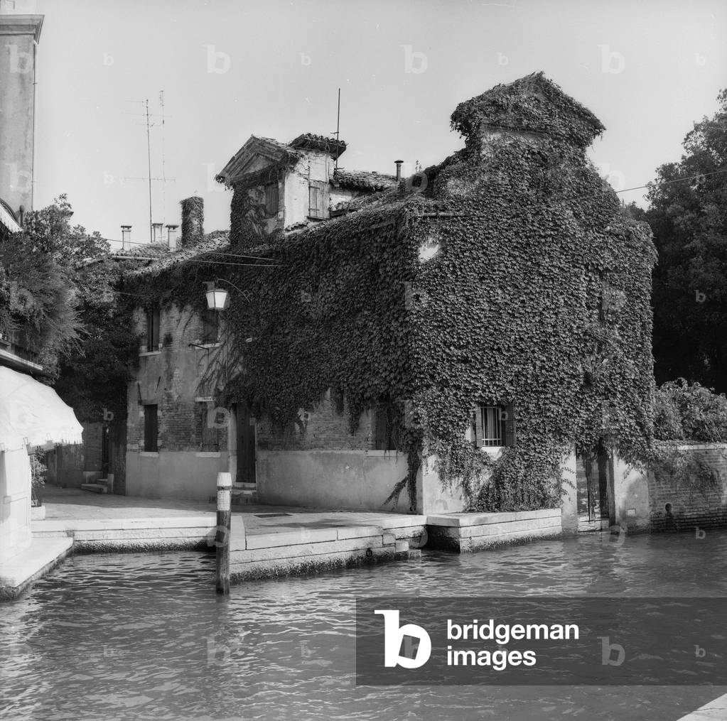 House overlooking a canal in Venice (b/w photo)