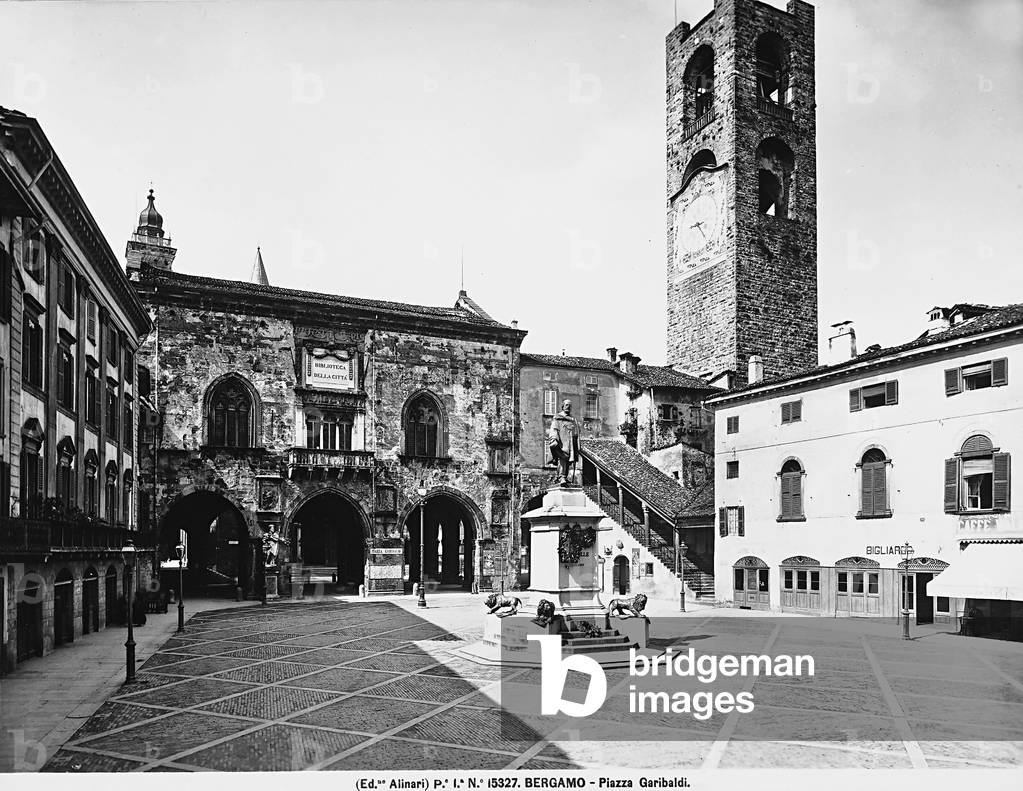 View of the Piazza Vecchia in Bergamo. In the background is the Palazzo della Ragione, with the large ground gallery and, on the right, the City Tower, called the Campanone.