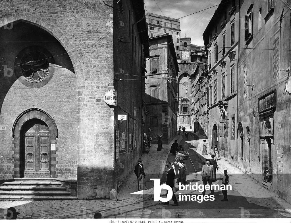 View of Corso Cavour in Perugia. The street is crowded with numerous passers-by