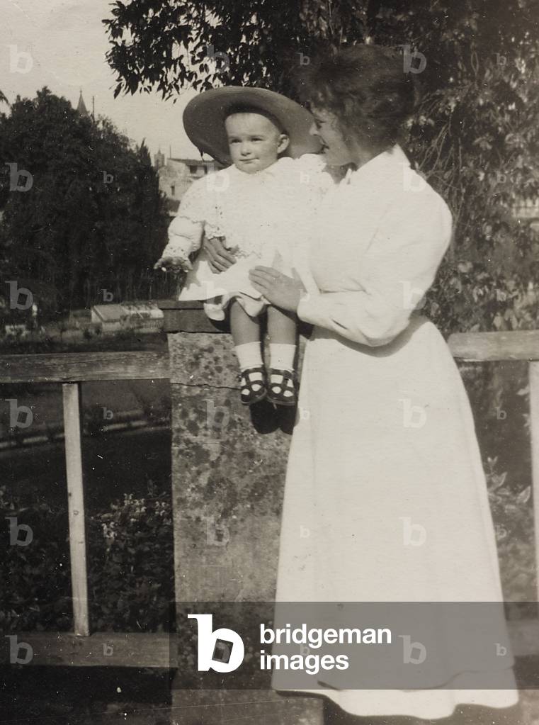 Portrait of a young woman with a baby in her arms; the support contains the indication 