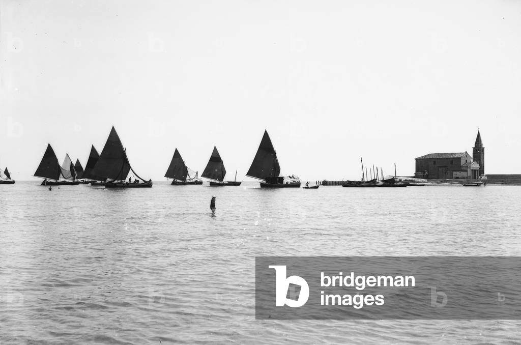View of Caorle: the Bragozzi (northern Adriatic fishing boats) and the Madonna dell'Angelo sanctuary