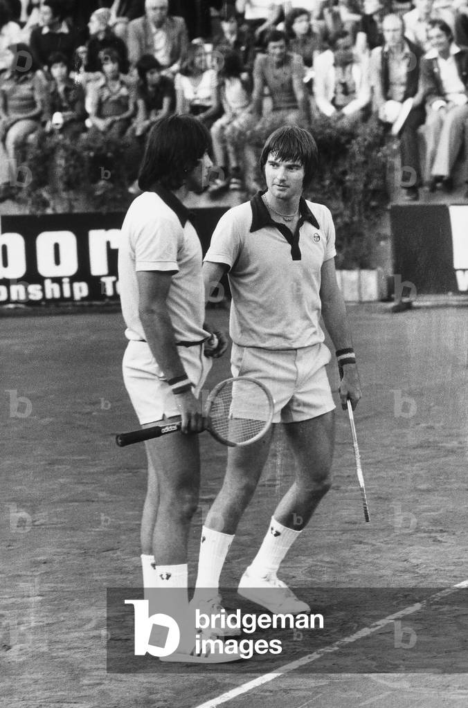 The tennis players Jimmy Connors and Ilie Nastase during a doubles match at the Foro Italico in Rome.