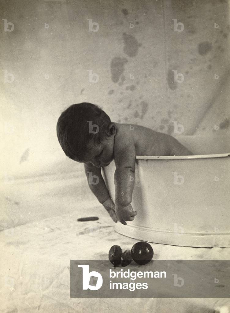 Portrait of a small boy in a tub