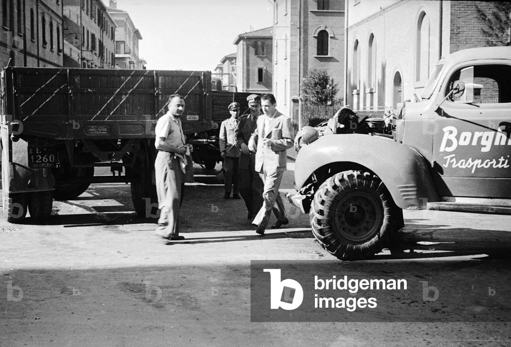 Scene of an accident in the city: collision between a truck and a van transport company Borghi (b/w photo)