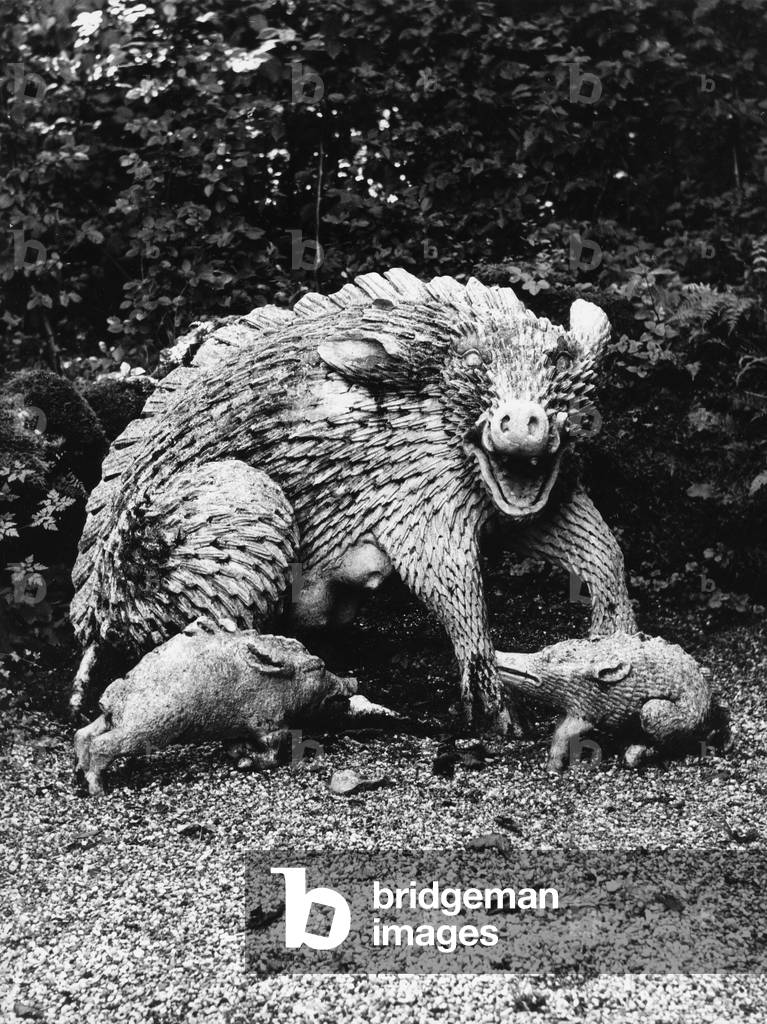 Sculptures depicting a boar with the puppies in the garden of the Palace of Hellbrunn in Salzburg (b/w photo)