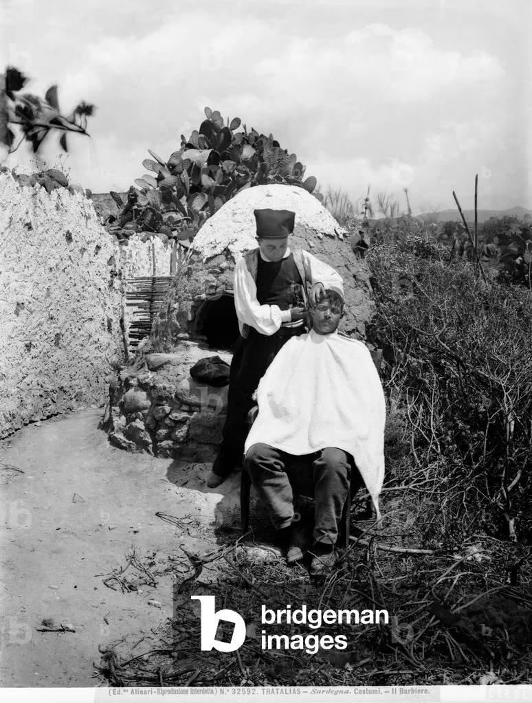 Photograph of a man shaving in a clearing in the open countryside, city of Tratalias, Sardinia.