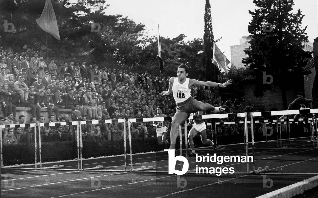 The ceremonies and games called by the Centro Sportivo Italiano: a crowd of spectators watches the hurdle competition