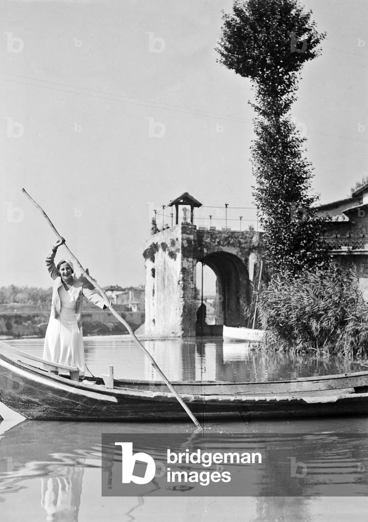 Portrait of a woman on board a boat near the water mill Rovezzano