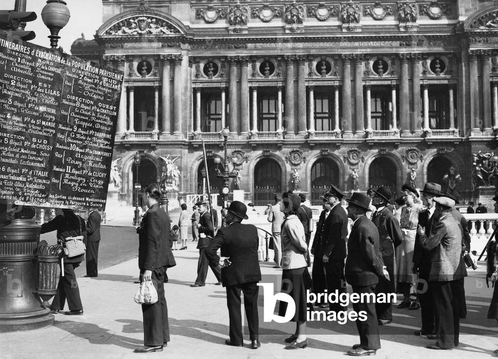 Sign with Paris evacuation routes (b/w photo)