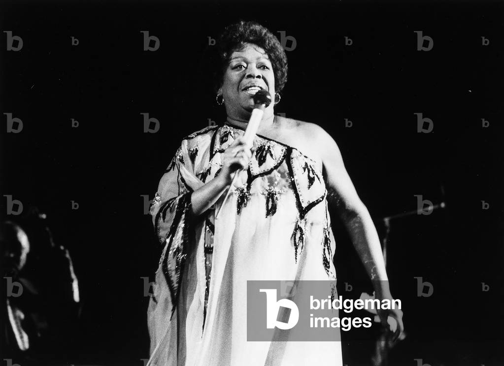 Portrait of the jazz singer Sarah Vaughan during a performance.