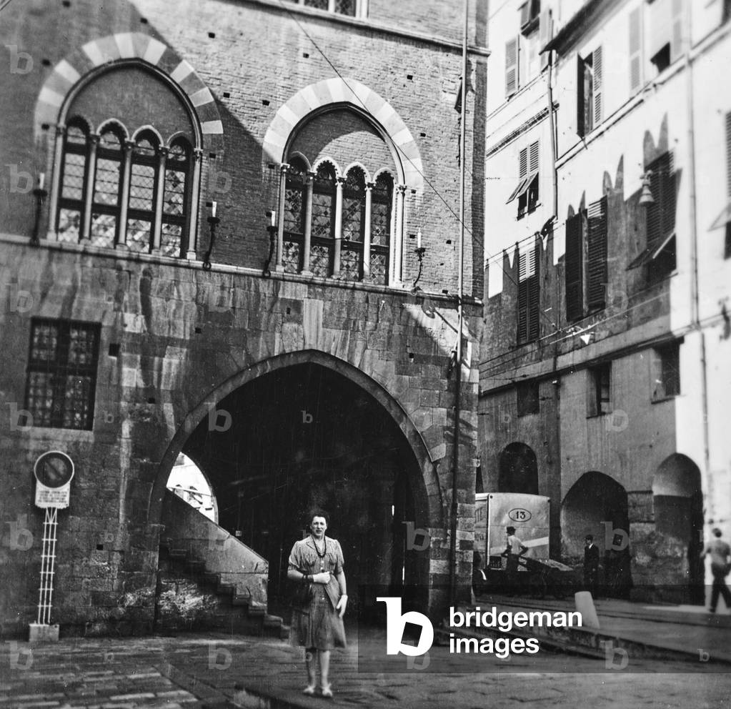 Female portrait in front of Palazzo San Giorgio, Genoa