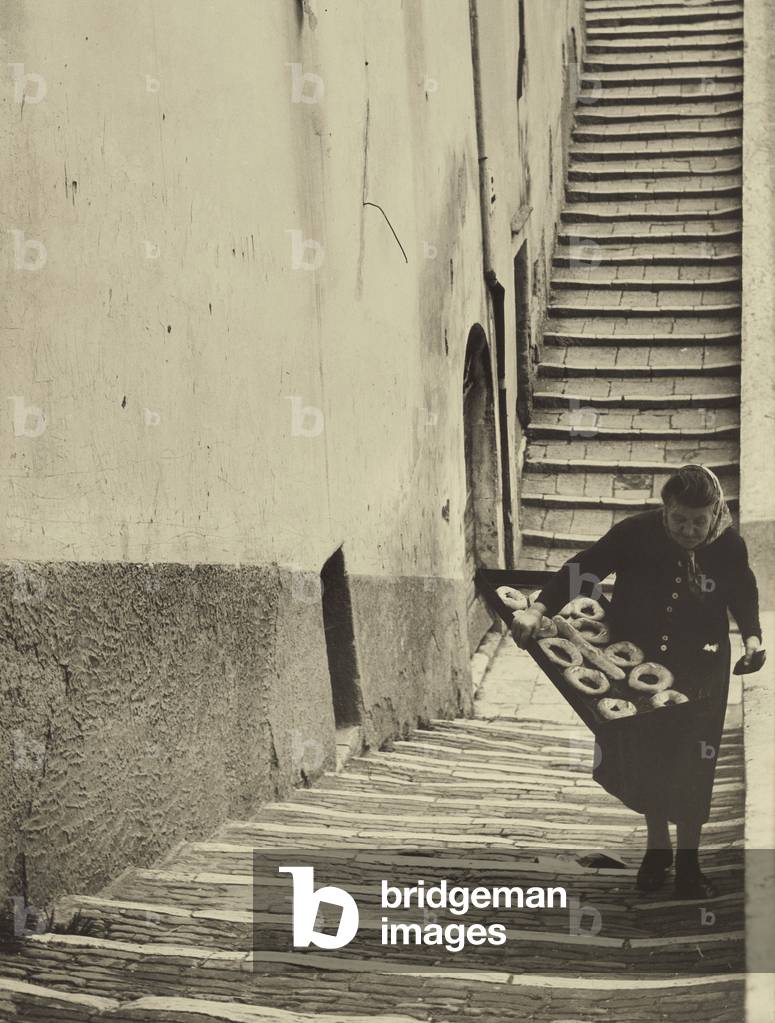 Old woman with a pan of 