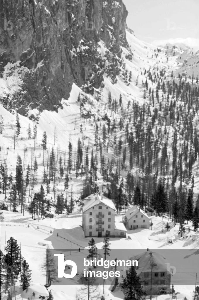 Snow in the mountains, view of snow-covered houses, Cortina d'Ampezzo