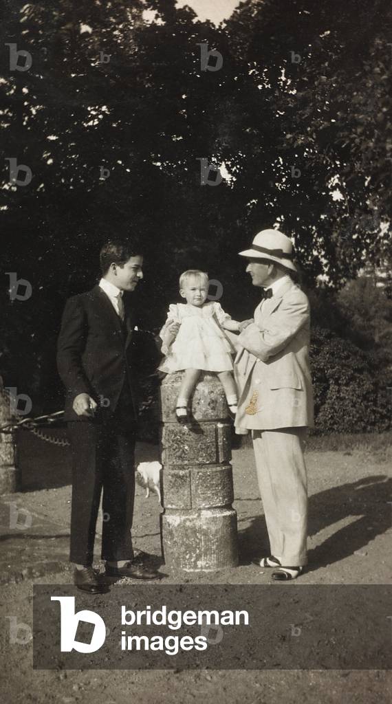 Portrait of a man with a girl and a boy in a garden; the support contains the indication 