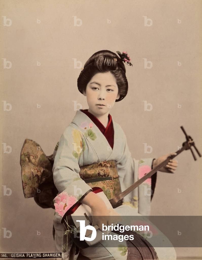 Portrait of a geisha playing the shamisen, c.1890 (coloured photo)