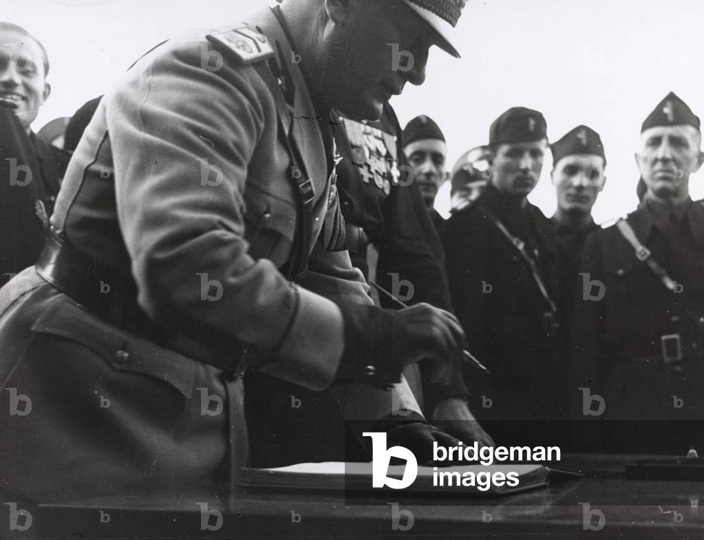 Benito Mussolini signed a register of honor (b/w photo)