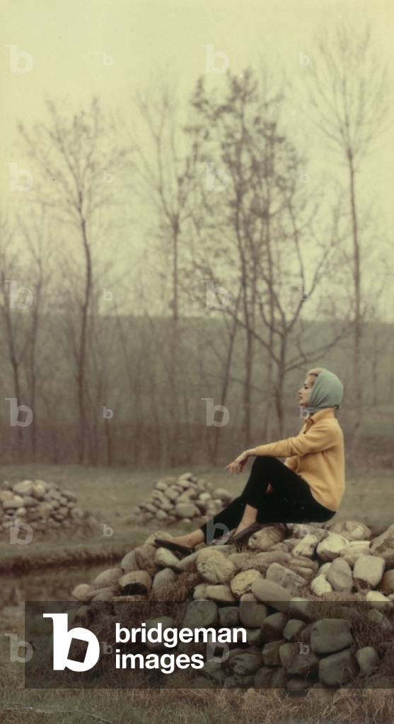 Model posing in a rural landscape, c.1960 (photo)