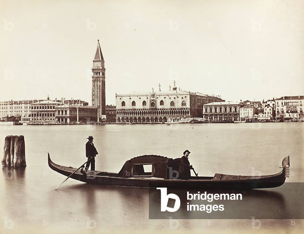 Gondoliers in the Venetian lagoon with the Bank of the Schiavoni in the background