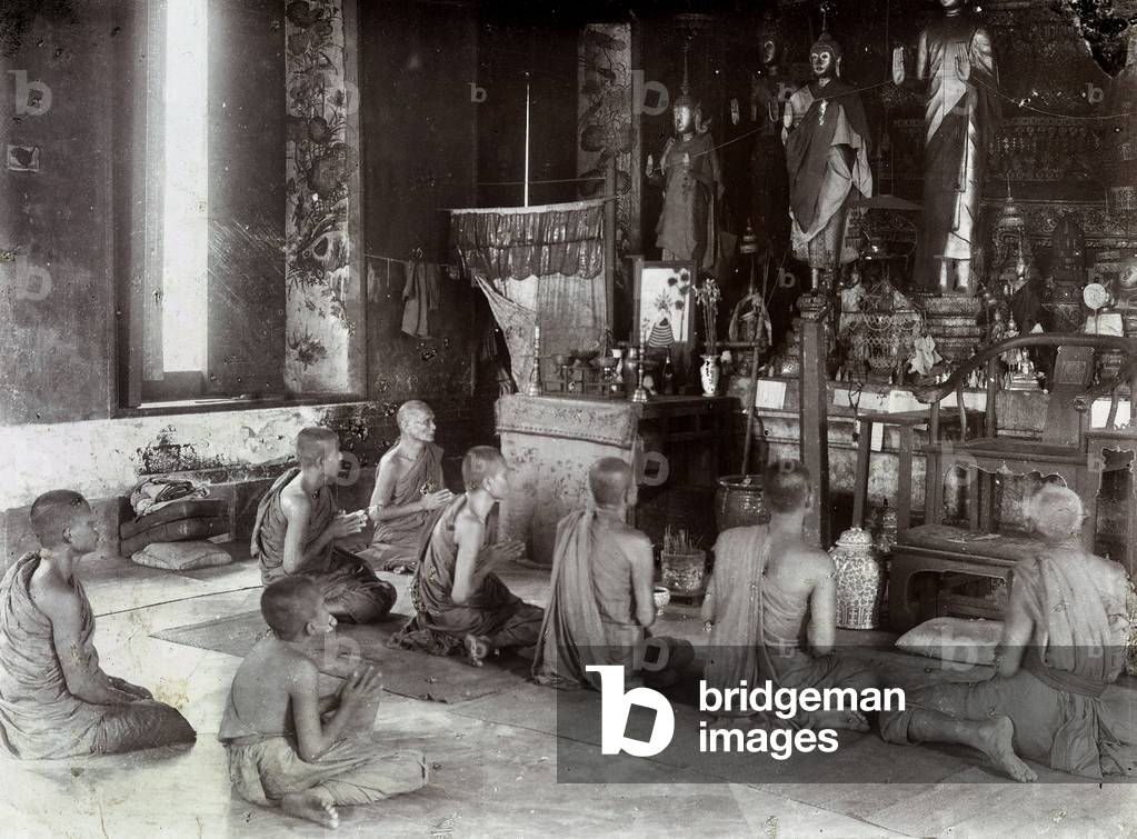 Group of young Buddhists in a temple of Bangkok