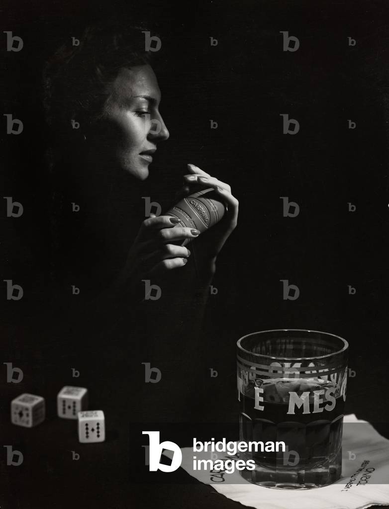 Young woman with nuts and a glass of vermouth Punt e Mes