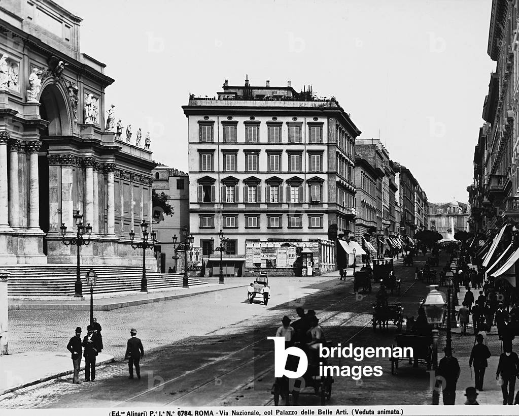 View of Via Nazionale in Rome, driven by carriages. On the left, the Palace of Exhibitions ( formerly seat of the Fine Arts )