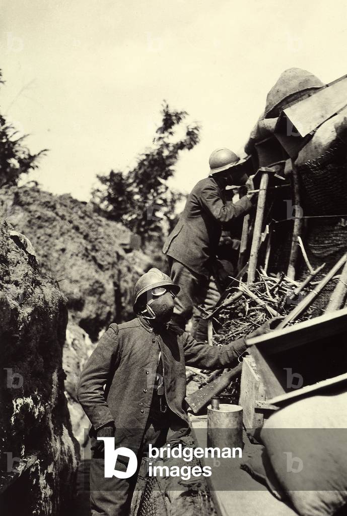 Italian soldiers with gas masks, in a trench of Lucinico, during World War I (b/w photo)
