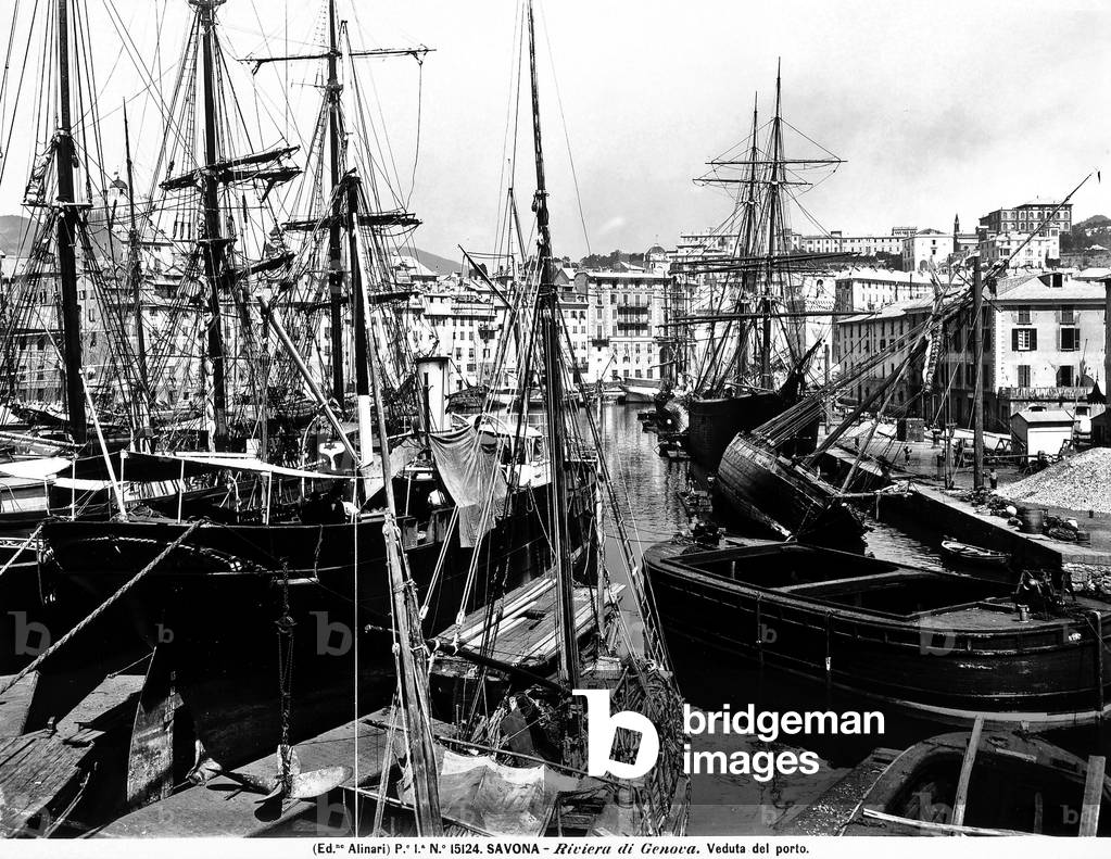 View of the port of Savona on the Ligurian riviera. The image shows numerous sailboats and a disused fishing boat.