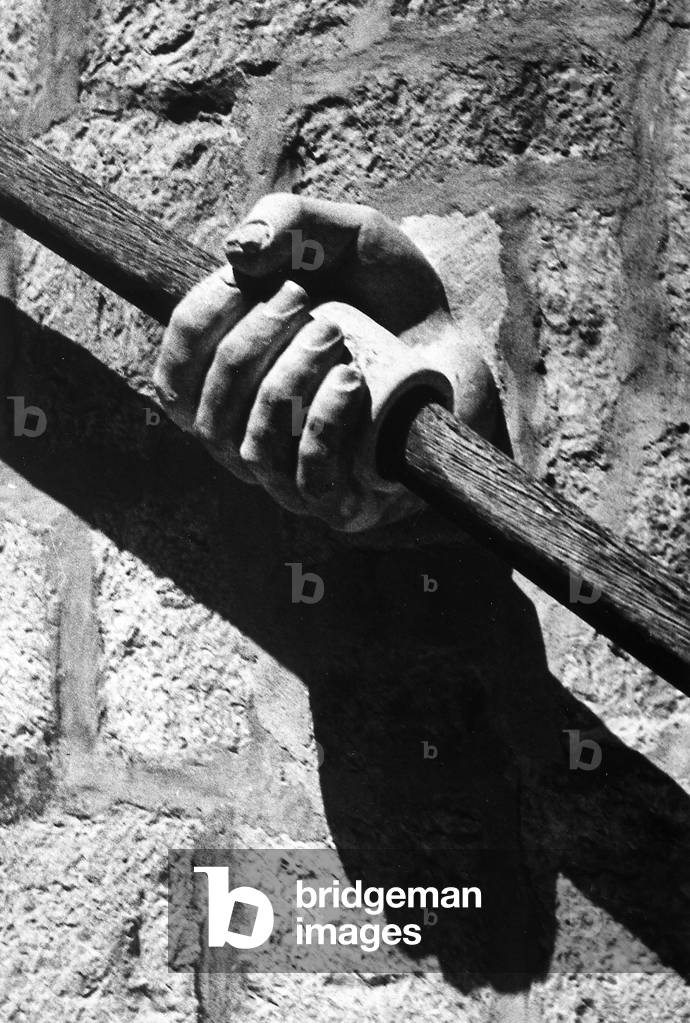 Detail of a hand on a railing