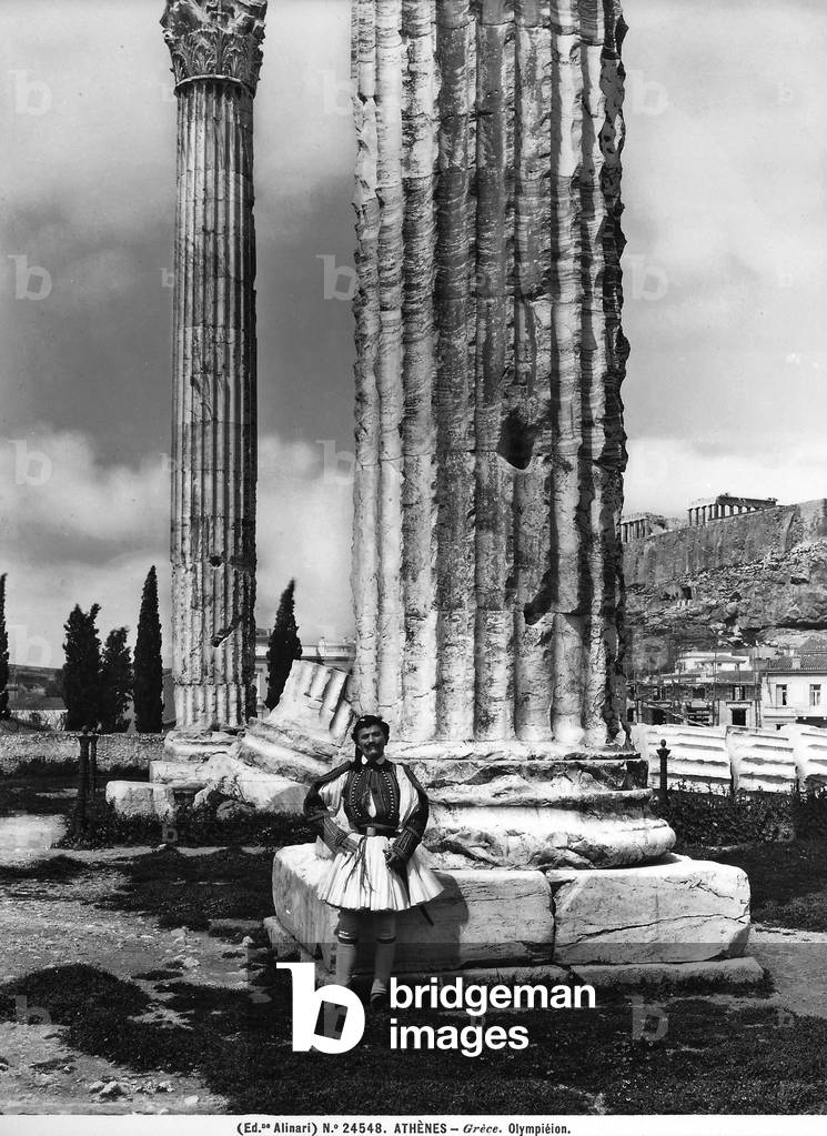 Picture taken from the Olimpeion; in the foreground is a man with traditional Greek garments.