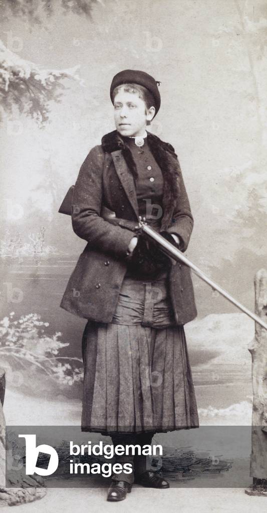 Young female hunter in traditional dress