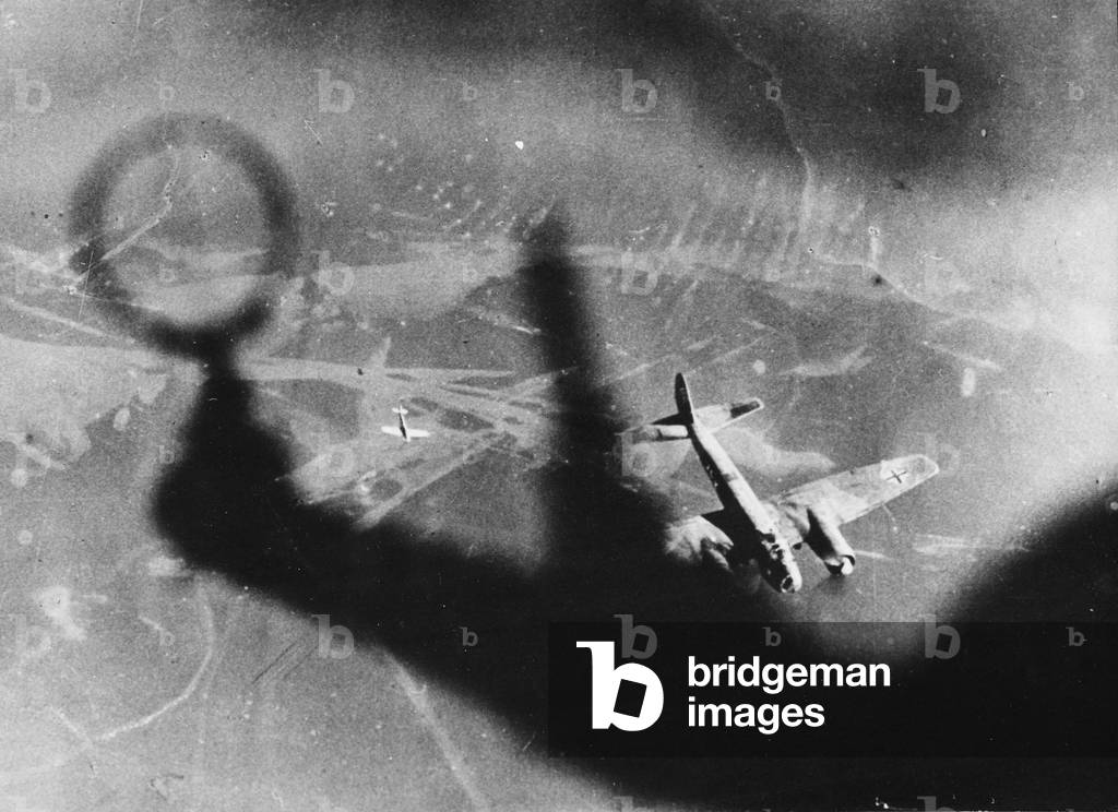 Air combat between a Spitfire and a German bomber (b/w photo)